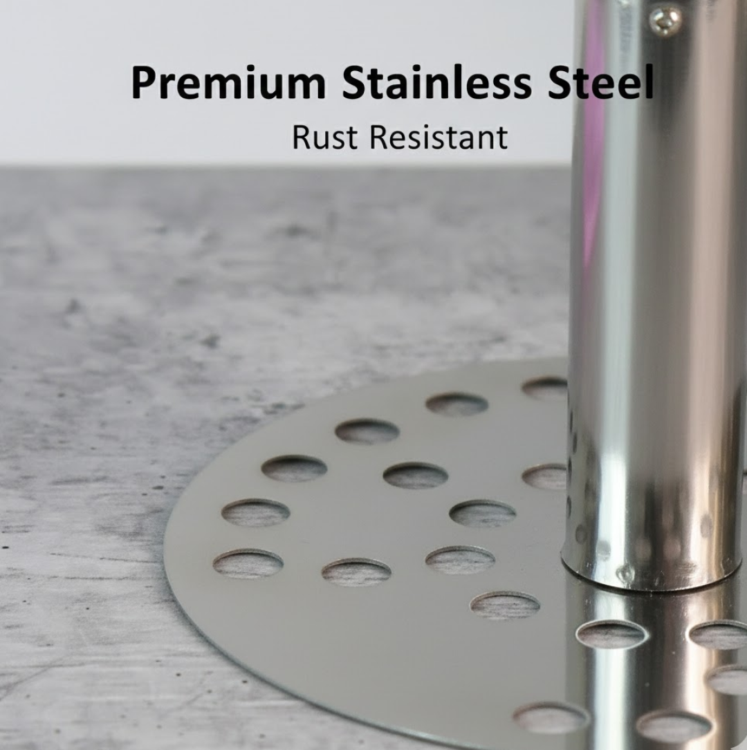 A close-up of the round, perforated stainless steel mashing plate and shiny metal shaft of the kitchen tool.