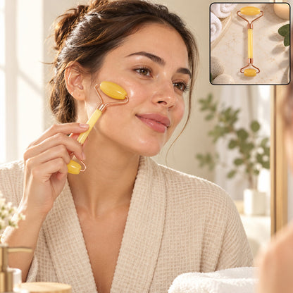 A woman in a white robe uses a yellow jade roller on her cheek, with a small inset showing the roller on a counter.