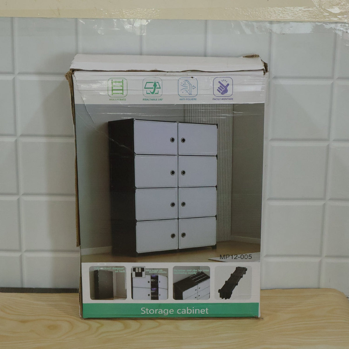 Cardboard box for a storage cabinet, showing an image of the product and assembly instructions.
