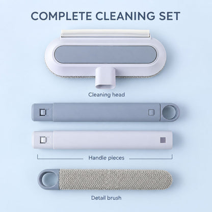 The cleaning set disassembled, showing the head, two handle pieces, and a separate detail brush on a blue surface.