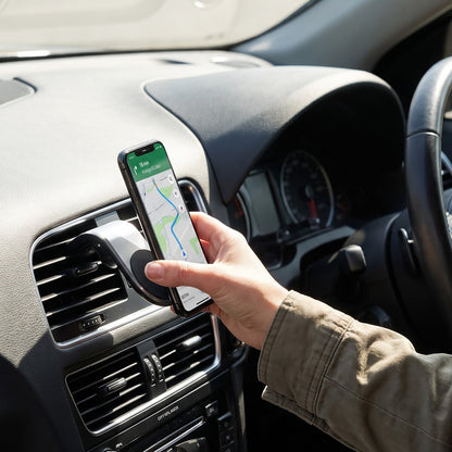 The product box for the magnetic car bracket holder is displayed next to the holder and a magnetic disc.