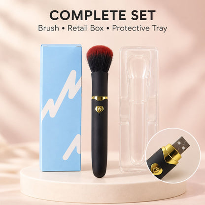 A light blue retail box and a black and red makeup brush in a clear plastic tray are arranged on a light wooden surface.
