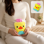 A woman holds a small yellow duck-shaped hot water bag on her abdomen, with an inset showing the bag.