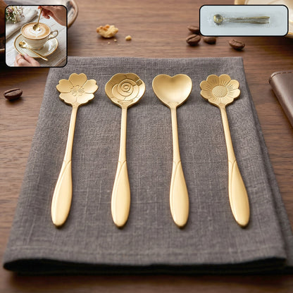 Four gold decorative spoons with flower and heart shapes on a gray napkin, with small inset images