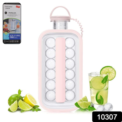 A pink ice cube bottle stands upright, surrounded by fresh lime, lemon, and mint, next to a glass of iced beverage.