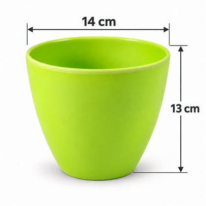 A green plastic pot with white arrows and text indicating its dimensions: 14 cm wide and 13 cm tall.
