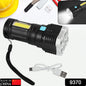 Black and silver flashlight with a wrist strap and a white USB charging cable, set against a background of tools.