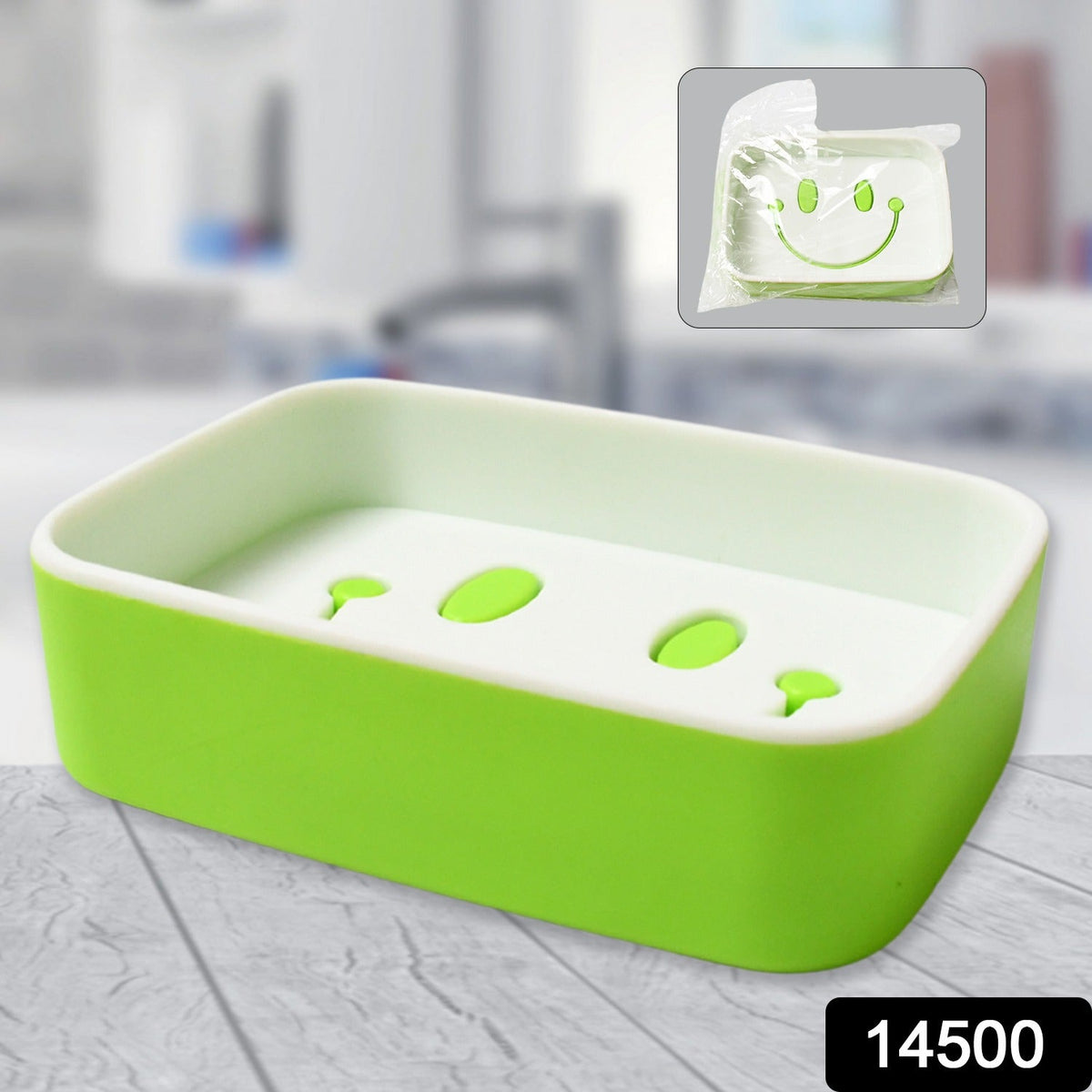 A green and white soap dish with a smiley face draining design, shown with a packaged version in the corner.