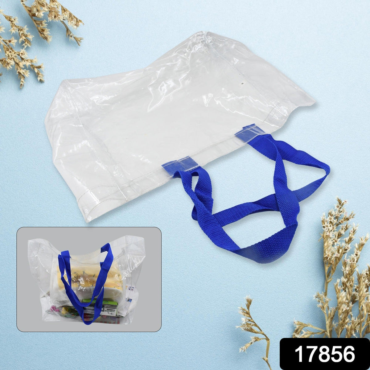 A clear PVC tote bag with blue handles is shown from above, with a smaller inset image of the bag filled with items.