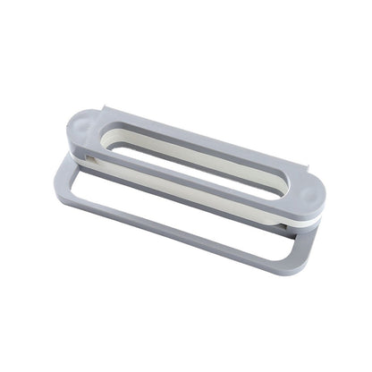 A gray and white folding shoe rack is shown from an angled perspective against a plain white background.