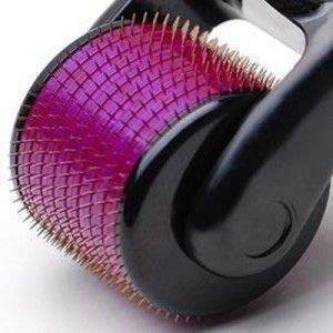 A close-up of the purple derma roller head with many small, sharp needles visible.