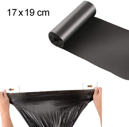 A black garbage bag being stretched by two hands, with a roll of bags and '17 x 19 cm' text above.