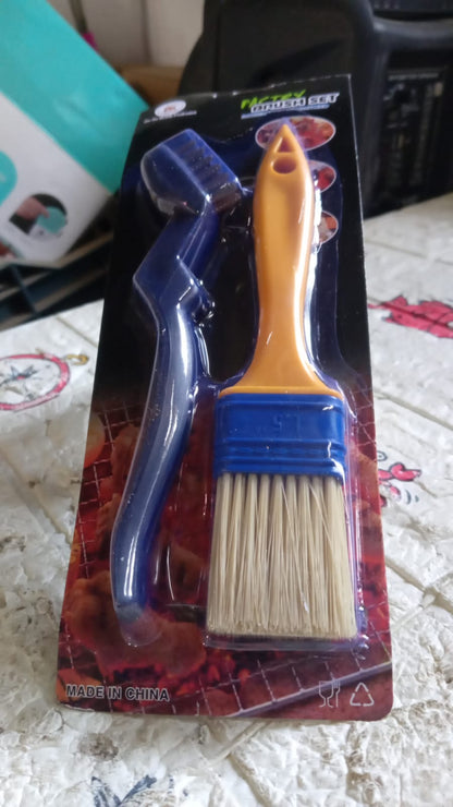 A packaged set of a blue grill brush and a yellow basting brush is shown on a patterned surface.