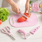 A person slices red tomatoes on a pink cutting board with a matching pink knife, alongside a peeler and scissors.
