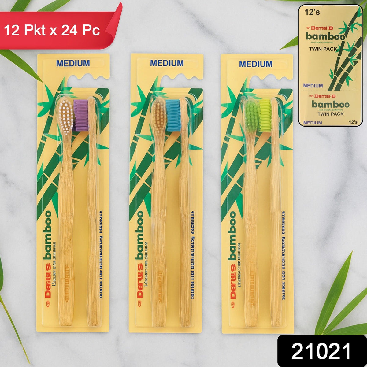 Three twin packs of bamboo toothbrushes with purple, blue, and green bristles on a marble surface with product labels.