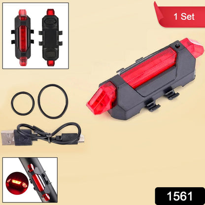 A red LED bicycle tail light with a USB cable and two rubber rings on a white background. Insets show the light from front