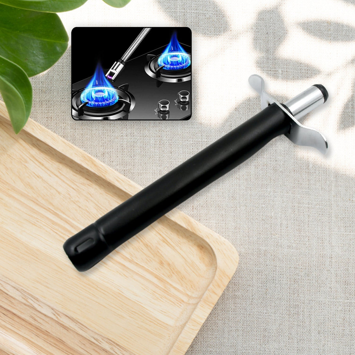 A black and silver gas lighter rests on a wooden tray, with a small inset showing a blue gas flame.