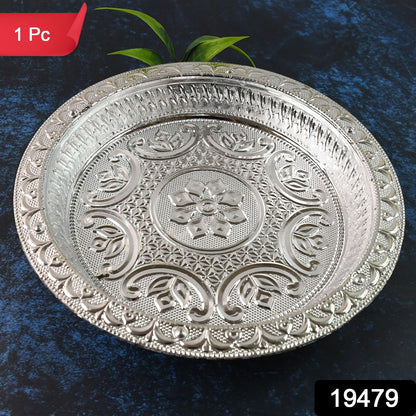 A round silver-colored plastic pooja thali with intricate embossed floral and geometric patterns, with a red "1 Pc" label.