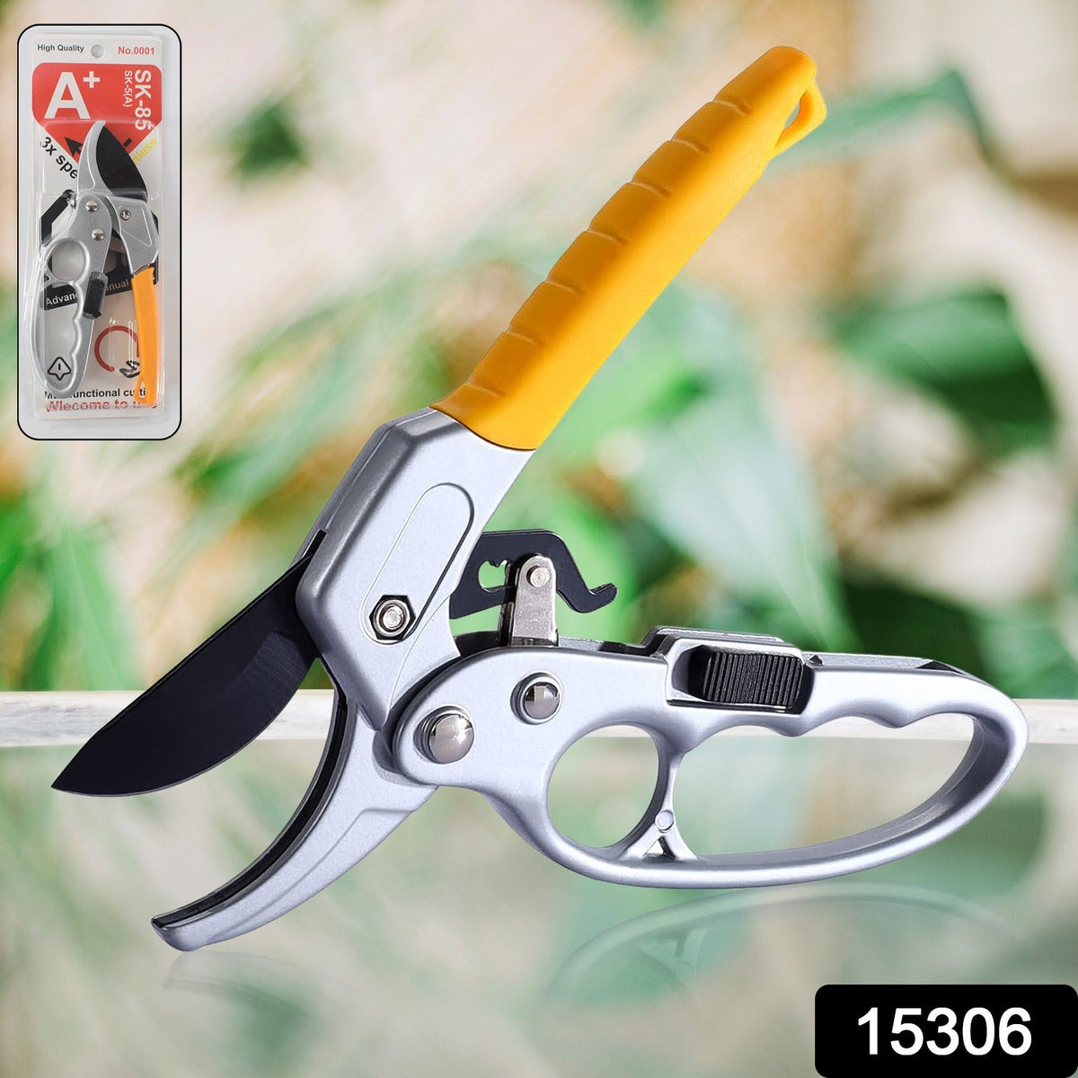 Silver and yellow pruning shears with black blades shown with its retail packaging in the upper left corner.