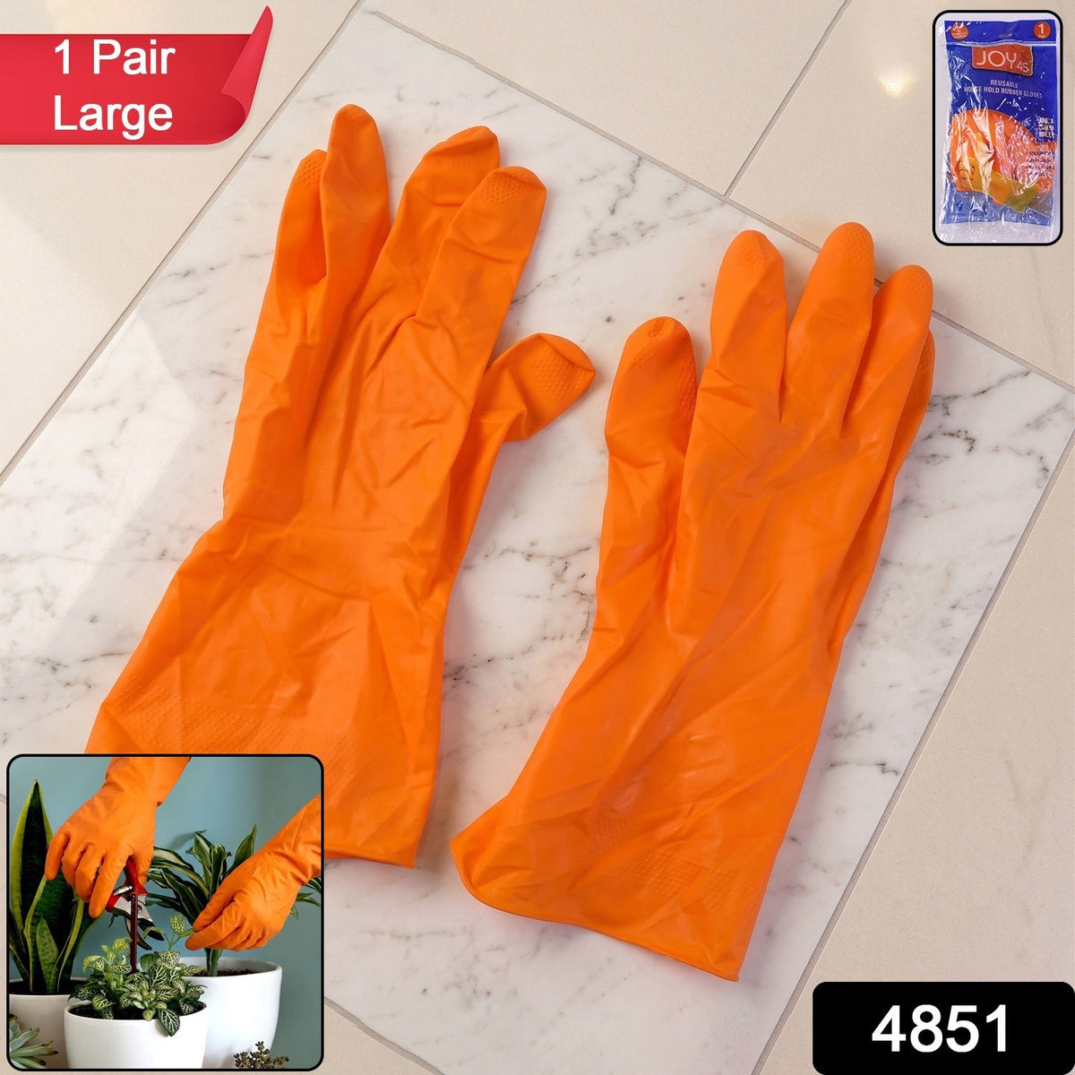 A pair of orange rubber gloves lies on a white marble floor, with a small packaged pair in the top right corner.