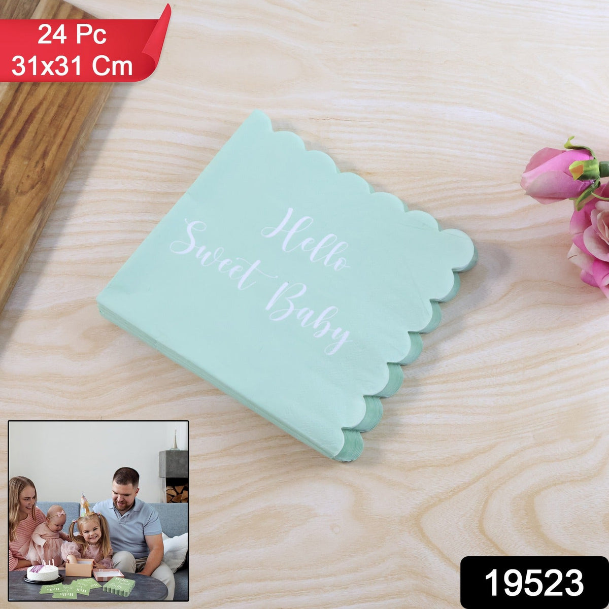 A stack of mint green scalloped napkins with "Hello Sweet Baby" in white script, on a wooden surface.