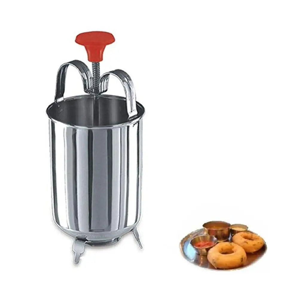 A stainless steel medu vada maker with a red handle and a small plate of vadas with sauces on a white background.