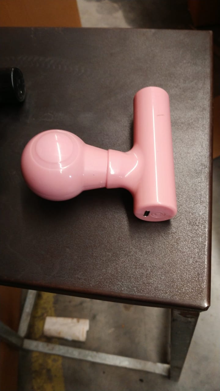 Black mini body massager presented in its retail box packaging, great for gifting.