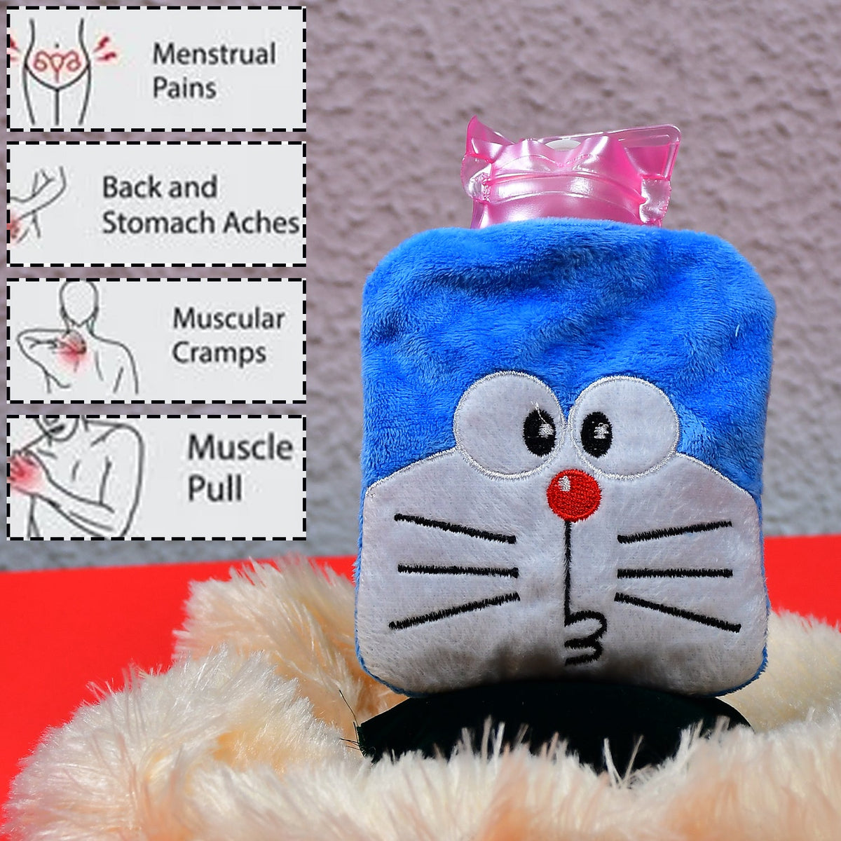 Blue Doraemon plush hot water bag with a pink stopper, with text describing its uses for pain relief.