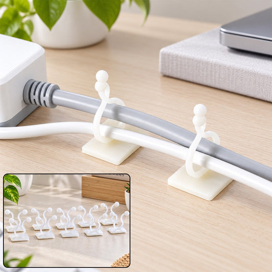 Two white self-adhesive clips securing a grey and a white cable to a light wooden desk, with a small inset of eight clips.