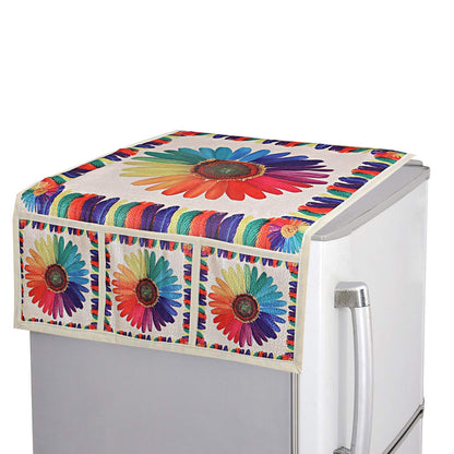 A refrigerator top cover with a large rainbow sunflower design and matching pocket details on a silver fridge.