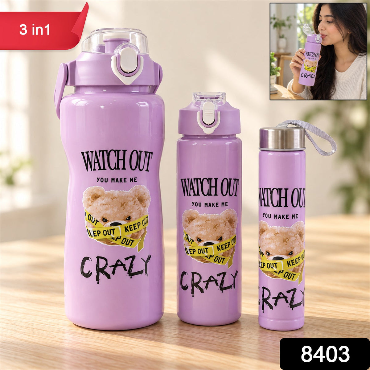 Three purple water bottles with a teddy bear design, in varying sizes, with a small inset image of a person drinking.