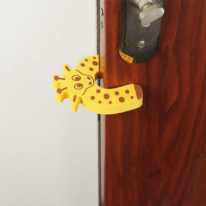 A yellow giraffe-shaped EVA door stopper is shown from a different angle, wedged on a brown door.