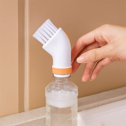 A hand attaches the cream and orange brush to a clear water bottle filled with bubbly water.