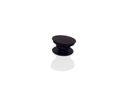 A single black phone grip is shown in its expanded state on a reflective white surface.