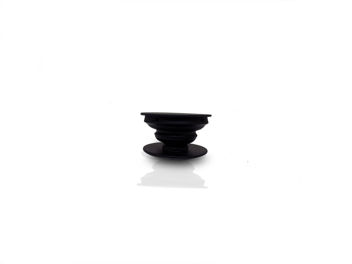 A black phone grip is shown fully expanded, showcasing its ribbed, collapsible design.