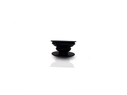 A black phone grip is shown fully expanded, showcasing its ribbed, collapsible design.