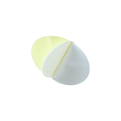 A single oval pad with white foam and a yellow adhesive layer, folded to show both sides on a white background.