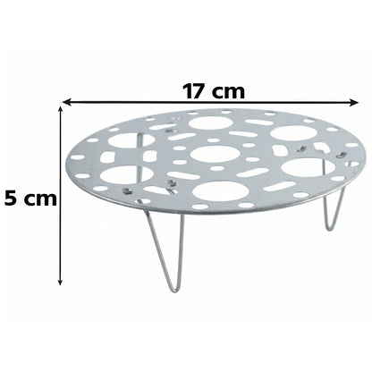 A silver metal steamer rack with three legs is shown against white, with dimensions of 17 cm width and 5 cm height indicated.