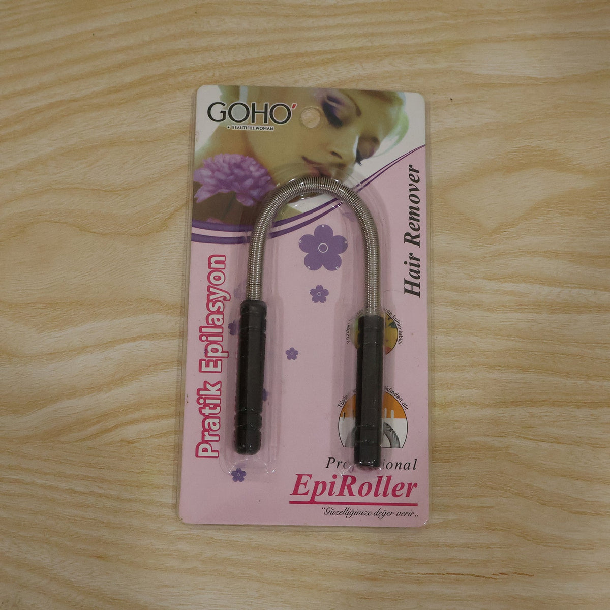 A packaged GOHO Professional EpiRoller hair remover is displayed on a light wooden surface.