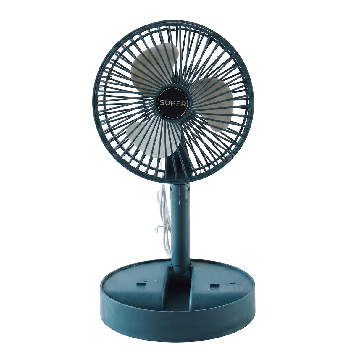 A young girl smiles while sitting at a desk with a dark green portable fan blowing cool air.