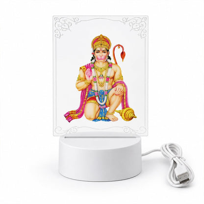 A Hanuman LED acrylic night lamp with a white base and coiled USB cable, set against a plain background.