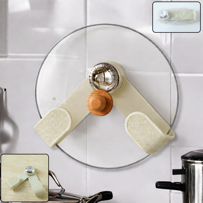 A cream-colored, adjustable pot lid holder with a wooden knob and chrome accent holds a clear glass lid on a white tiled