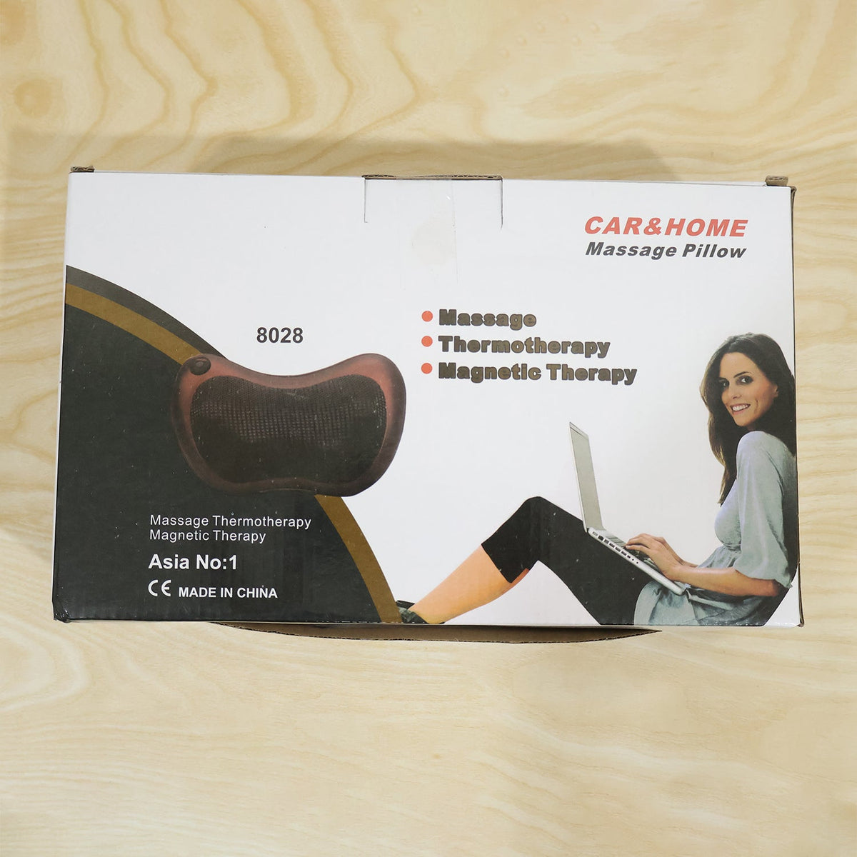Brown shiatsu massage pillow with heat in a home setting, illustrating its use for relaxation.