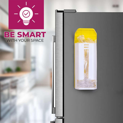 A white and yellow plastic bag dispenser with clear bags inside is mounted on the side of a stainless steel refrigerator.