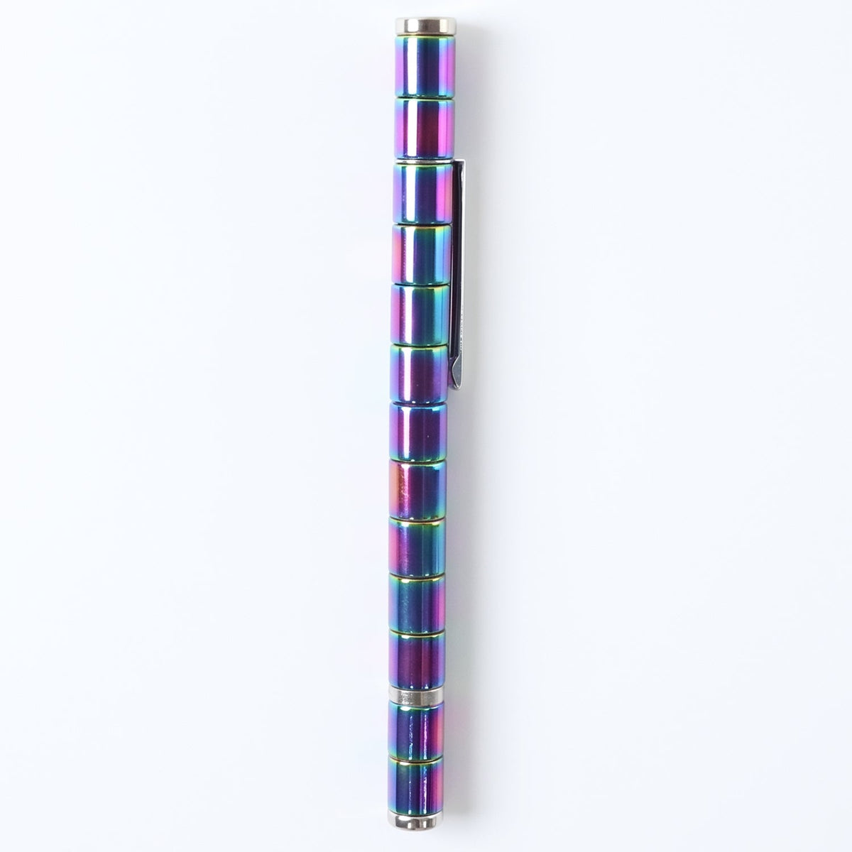 A rainbow-colored magnetic fidget pen with a silver clip is centered vertically on a white background.