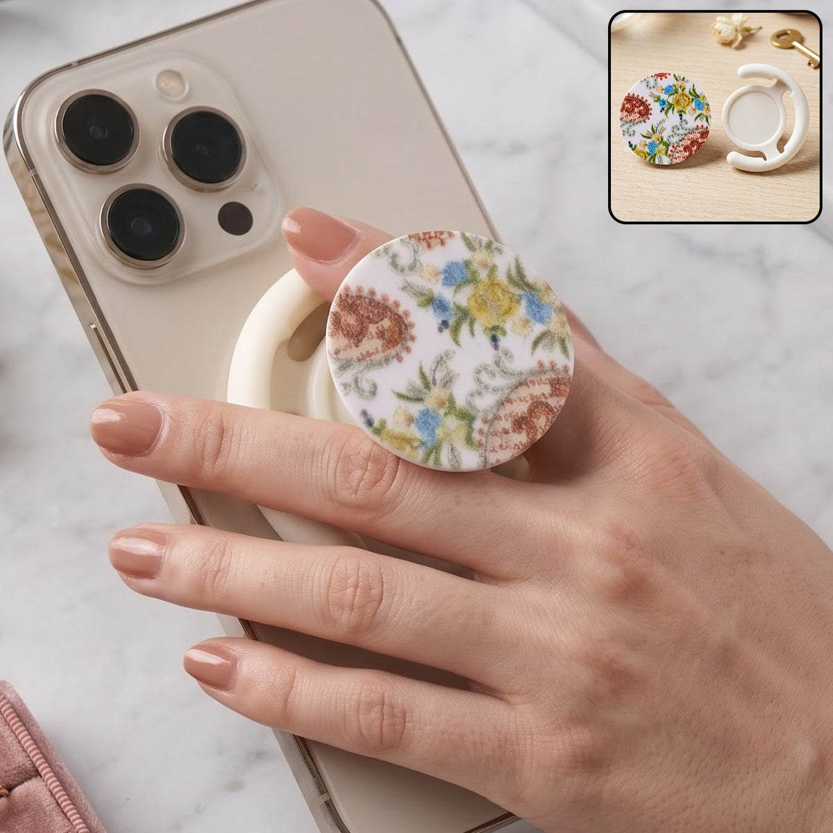 A hand holds a white smartphone with a round pop socket featuring a white background and colorful paisley floral – view 8