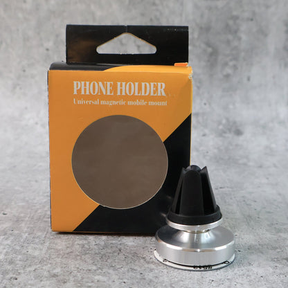 Rotating magnetic phone holder securing a smartphone on a car's air vent.