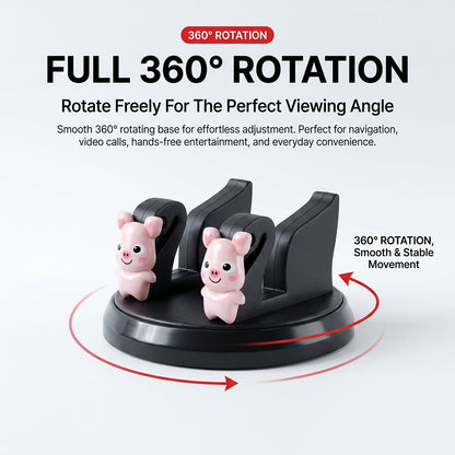 A black phone holder with two pink pig figurines, illustrating its 360-degree rotation capability.