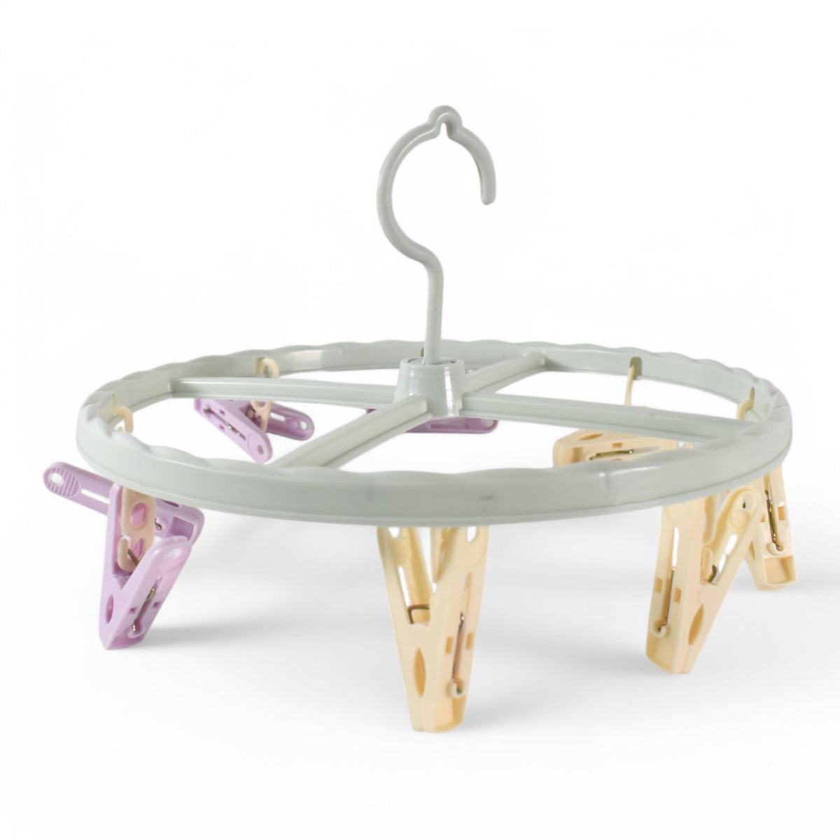 A light blue circular drying rack with purple and yellow clips is shown against a plain white background.