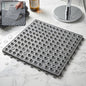 Black bathroom anti skidding mat with textured surface and drainage holes